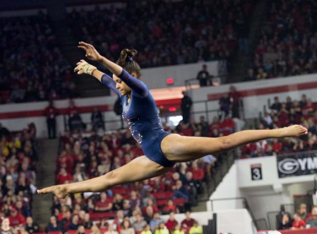 Brianna Brown leaps on floor.jpg